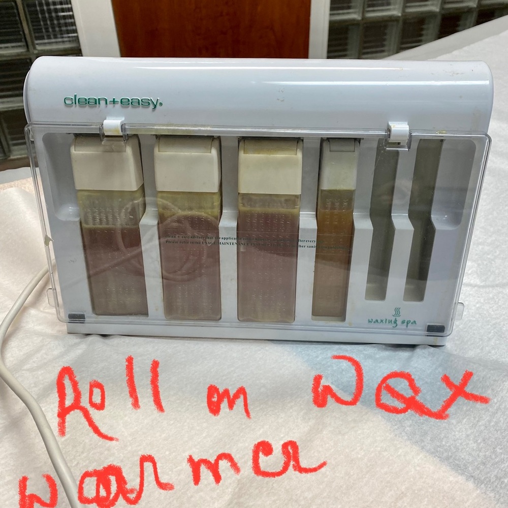 Clean and easy roll on wax warmer with wax and thermal holder.